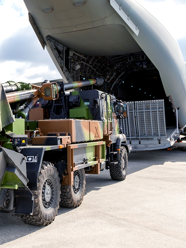 Loading a military vehicle onto an airplane