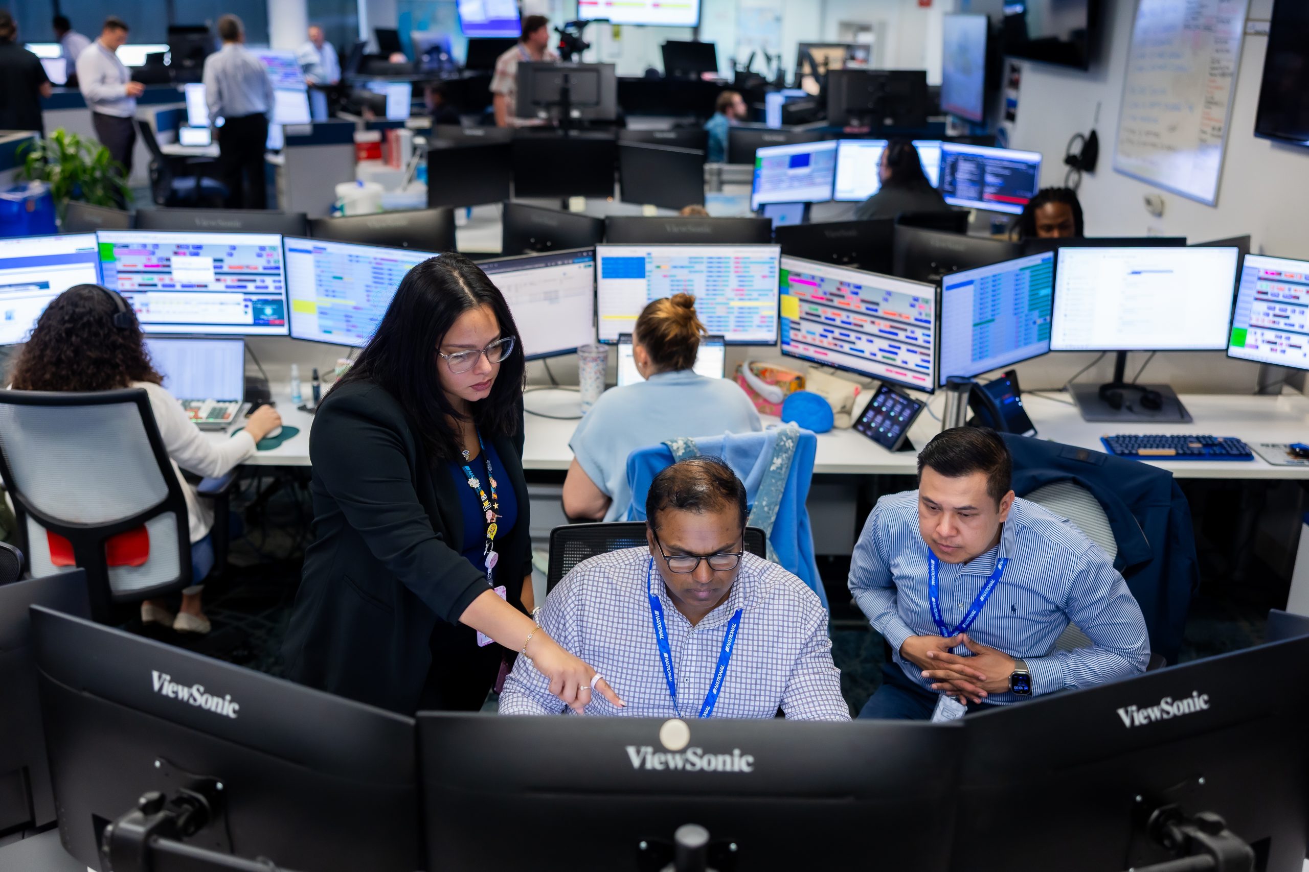 Workers looking at monitors